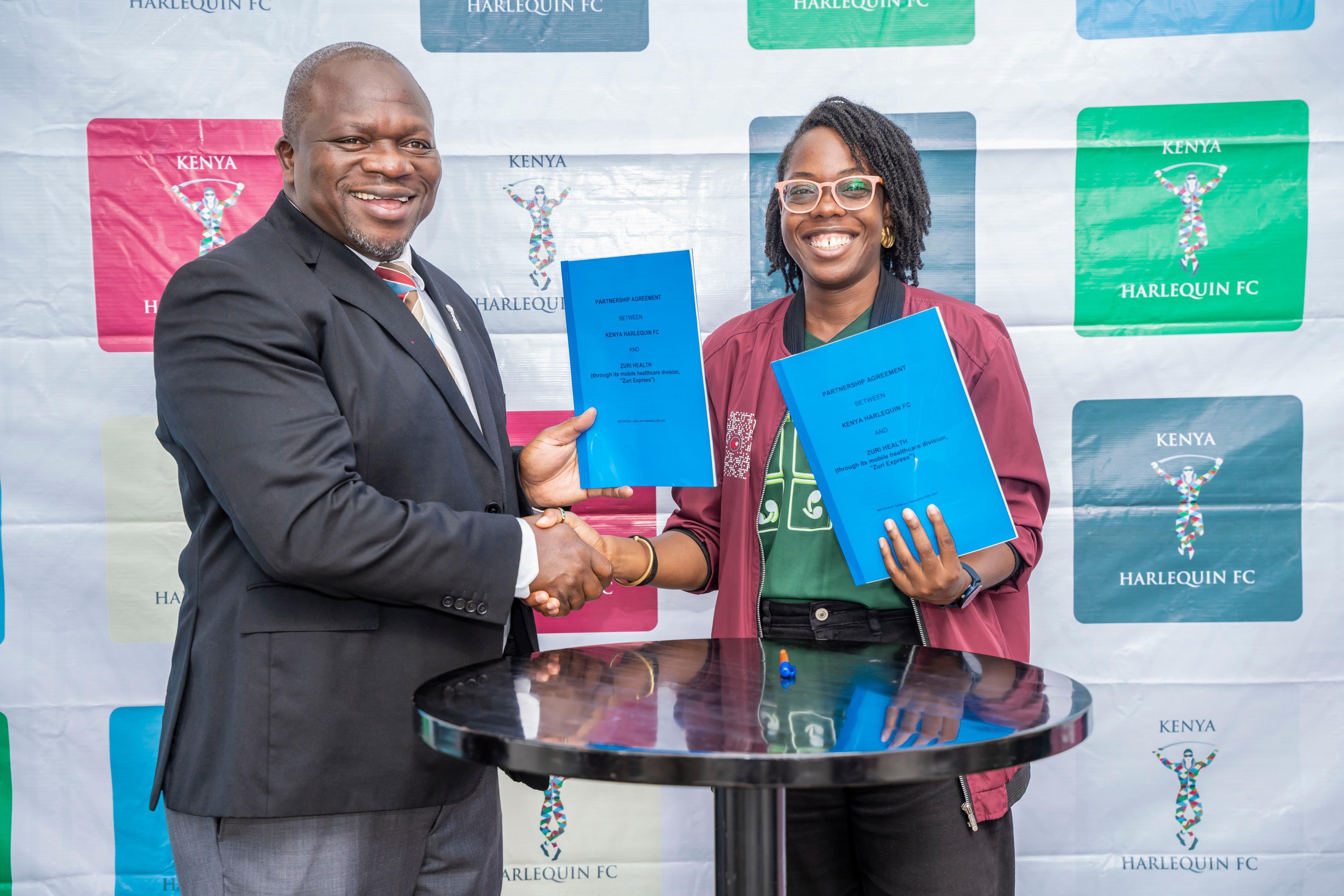 Victor Sudi (Kenya Harlequin FC Chairman) and Uchenna Ezedinachi (Chief of Staff, Zuri Health) holding the signed partnership agreement